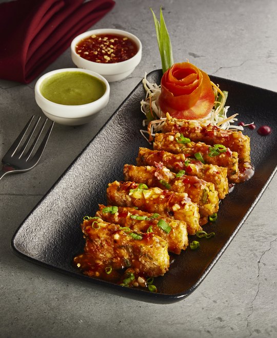 Karachi-style vegetarian dish garnished with fresh herbs.