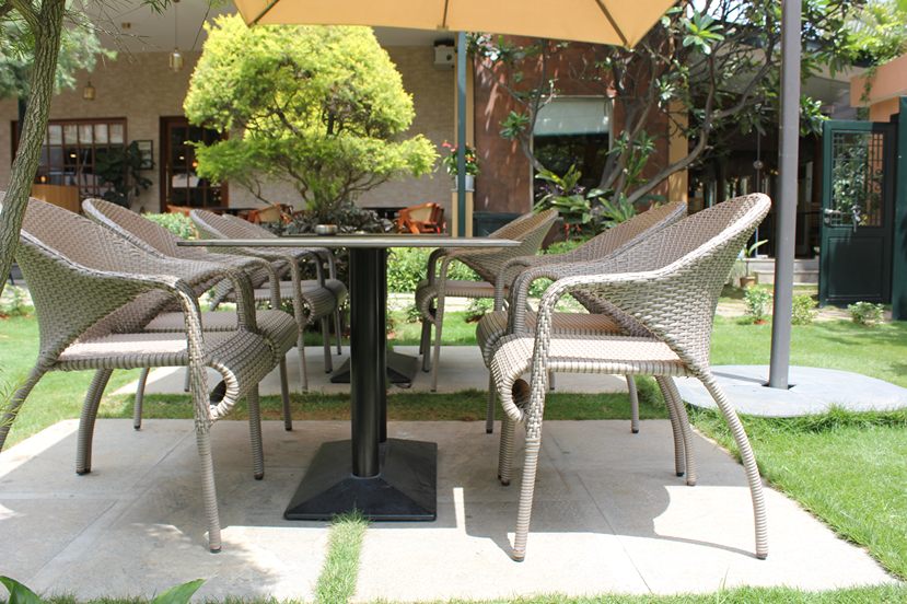 Outdoor seating in garden area at Marigold Whitefield