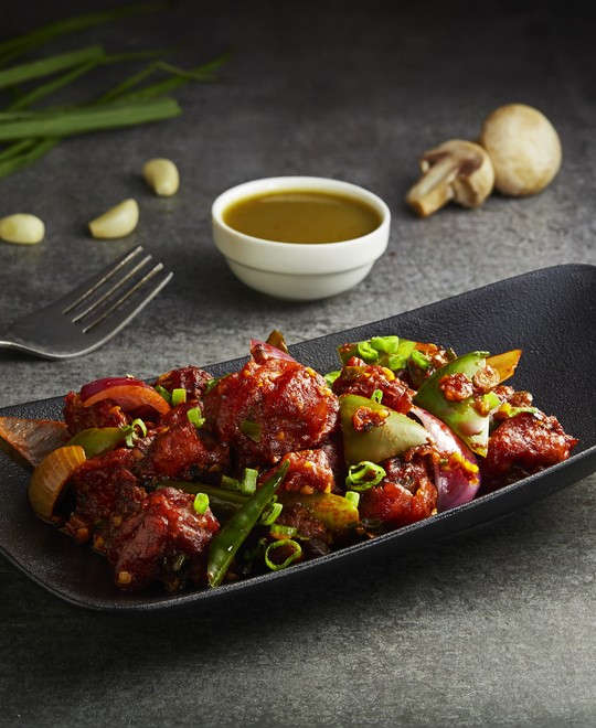 Spicy Mushroom Chilli garnished with green onions